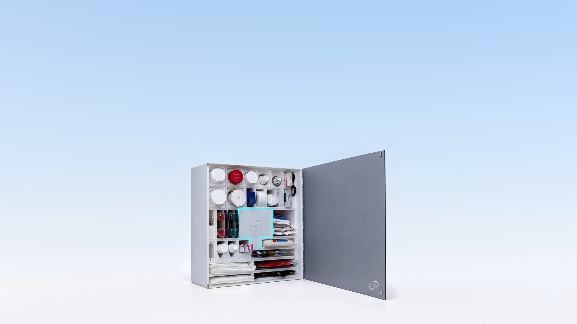 The Solstis cabinet, its door open and its cyan glow on, standing on a light studio floor under a soft blue sky.